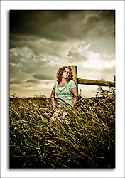 dgmphotography Investment Page Image 6 HS Senior Girl in a wheatfield with stormy skies